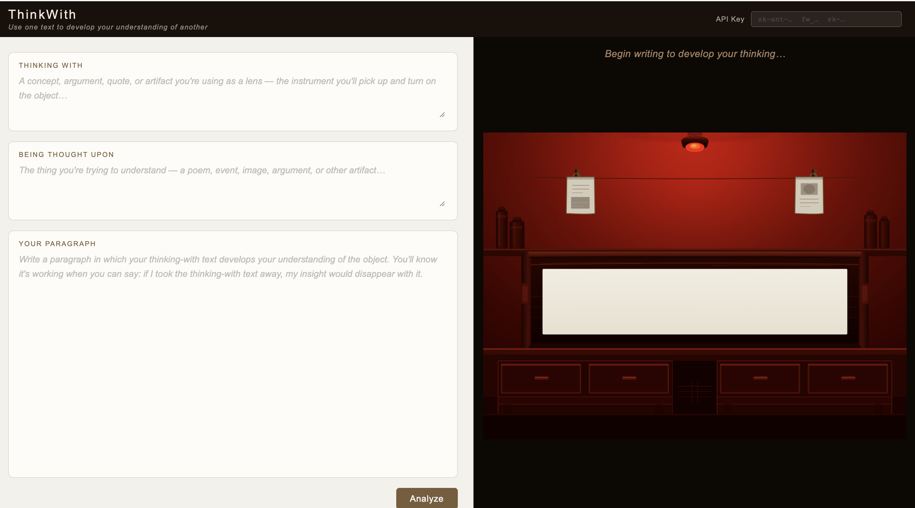 The ThinkWith tool's two-panel interface. On the left, three labeled text fields: 'Thinking With,' 'Being Thought Upon,' and 'Your Paragraph,' with an 'Analyze' button. On the right, an illustrated red-lit darkroom with a sheet of photographic paper developing and the prompt 'Begin writing to develop your thinking…'